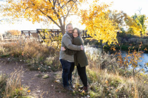 Littleton family photographer Carson Nature Center Colorado fall color bridge brother sister mother father siblings daughter son photography foothills dog fence log