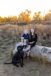 Littleton family photographer Carson Nature Center Colorado fall color bridge brother sister mother father siblings daughter son photography foothills dog fence log