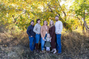 Littleton family photographer extended fall photo session Colorado grandmother granddaughter sisters husbands South Platte river area Carson Nature Center photography mother father child yellow leaves 