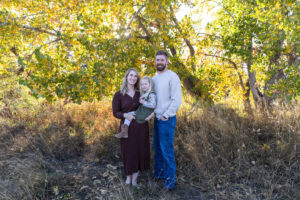 Littleton family photographer extended fall photo session Colorado grandmother granddaughter sisters husbands South Platte river area Carson Nature Center photography mother father child yellow leaves 
