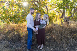 Littleton family photographer extended fall photo session Colorado grandmother granddaughter sisters husbands South Platte river area Carson Nature Center photography mother father child yellow leaves 