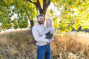 Littleton family photographer extended fall photo session Colorado grandmother granddaughter sisters husbands South Platte river area Carson Nature Center photography mother father child yellow leaves 