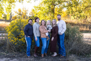 Littleton family photographer extended fall photo session Colorado grandmother granddaughter sisters husbands South Platte river area Carson Nature Center photography mother father child yellow leaves 