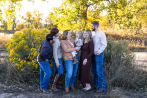 Littleton family photographer extended fall photo session Colorado grandmother granddaughter sisters husbands South Platte river area Carson Nature Center photography mother father child yellow leaves 