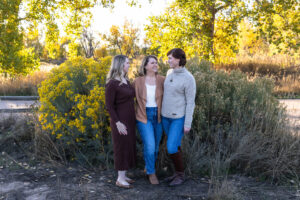 Littleton family photographer extended fall photo session Colorado grandmother granddaughter sisters husbands South Platte river area Carson Nature Center photography mother father child yellow leaves twins