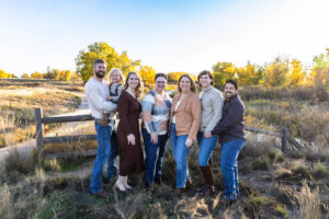 Littleton family photographer extended fall photo session Colorado grandmother granddaughter sisters husbands South Platte river area Carson Nature Center photography mother father child yellow leaves 