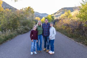 Littleton family photographer Morrison Park Colorado fall leaves color foothills photography brothers mother father sons bridge river