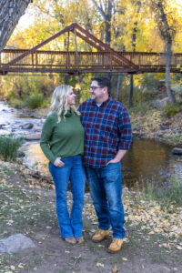 Littleton family photographer Morrison Park Colorado fall leaves color foothills photography brothers mother father sons bridge river