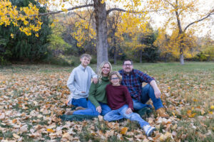 Littleton family photographer Morrison Park Colorado fall leaves color foothills photography brothers mother father sons bridge river