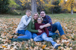 Littleton family photographer Morrison Park Colorado fall leaves color foothills photography brothers mother father sons bridge river