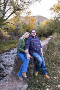 Littleton family photographer Morrison Park Colorado fall leaves color foothills photography brothers mother father sons bridge river