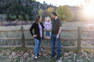Littleton family photographer Lair O' the Bear park Morrison Colorado fall dog mother father daughter toddler photography foothills field fence