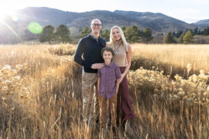 Littleton family photographer Colorado foothills mother father son kid child photography sunset Ken Caryl Valley grandmother aunts uncles red rocks