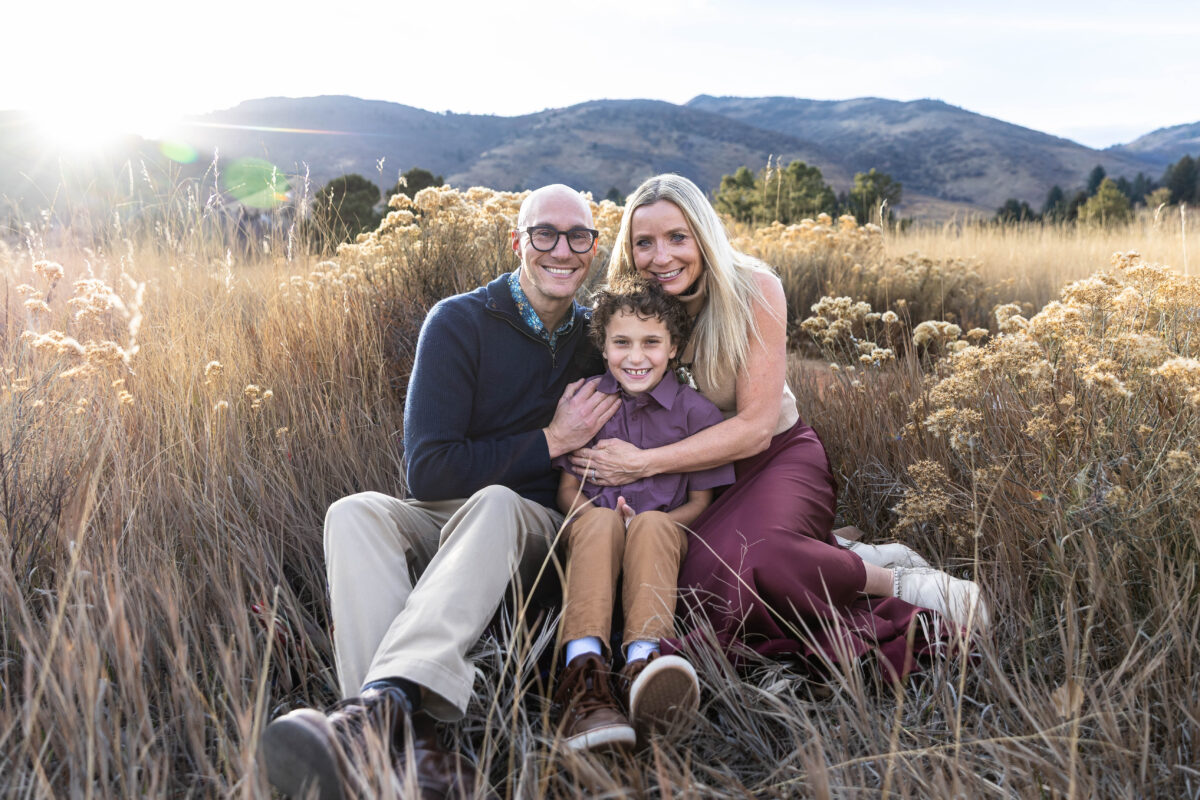 Littleton family photographer Colorado foothills mother father son kid child photography sunset Ken Caryl Valley grandmother aunts uncles red rocks