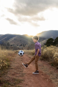 Littleton family photographer Colorado foothills mother father son kid child photography sunset Ken Caryl Valley grandmother aunts uncles red rocks soccer player