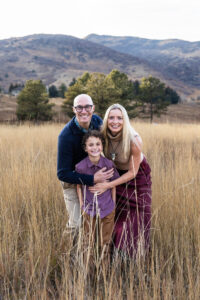 Littleton family photographer Colorado foothills mother father son kid child photography sunset Ken Caryl Valley grandmother aunts uncles red rocks