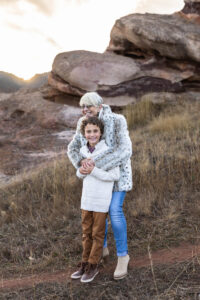 Littleton family photographer Colorado foothills mother father son kid child photography sunset Ken Caryl Valley grandmother aunts uncles red rocks