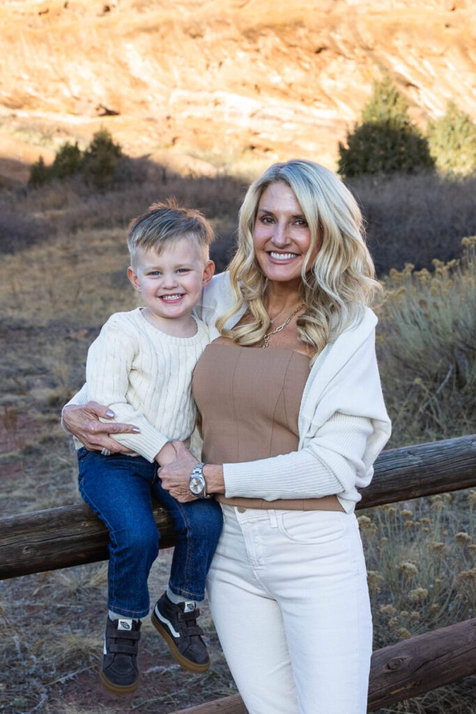 A grandmother snuggling her grandson at Red Rocks in Colorado. A photo by Littleton family photographer, Jen Honeycutt.