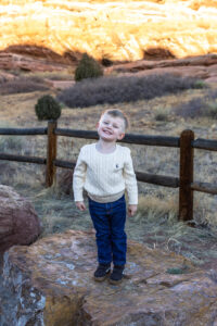 Littleton family photographer Red Rocks winter Colorado sister mother father brother son photography sunset grandson grandmother