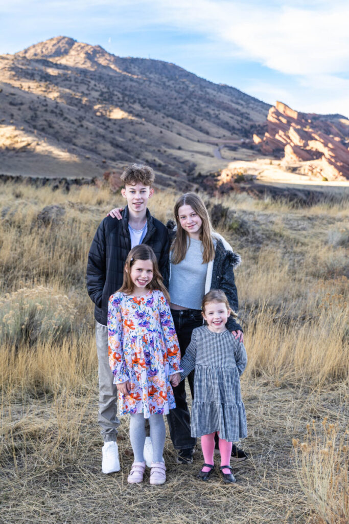 Cousins in Morrison near red rocks.  Littleton family photographer at Mt. Falcon Park.