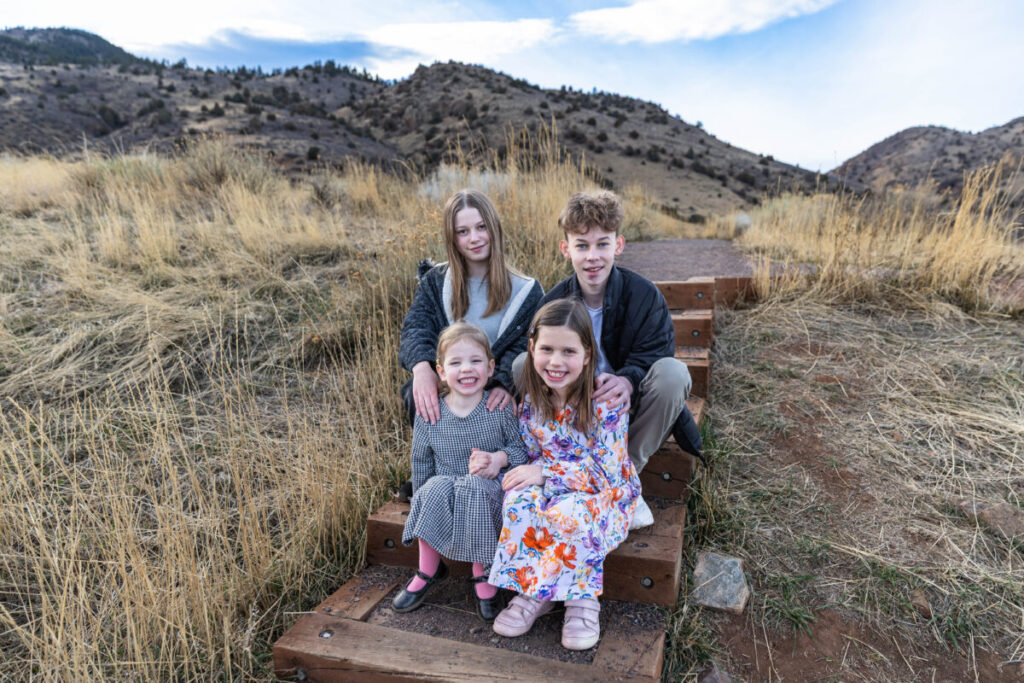Cousins at Mt. Falcon Park in Colorado.  Littleton family photographer near Red Rocks in Morrison.