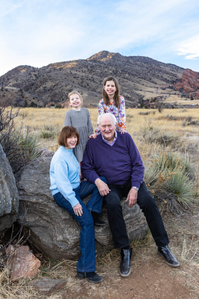 Littleton extended family photographer at Mt. Falcon Park in Morrison.  Grandparents with their granddaughters at Red Rocks.