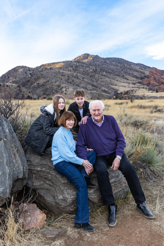 Grandparents with their grandchildren at a park near Red Rocks.  Colorado family photographer in Morrison over winter break.