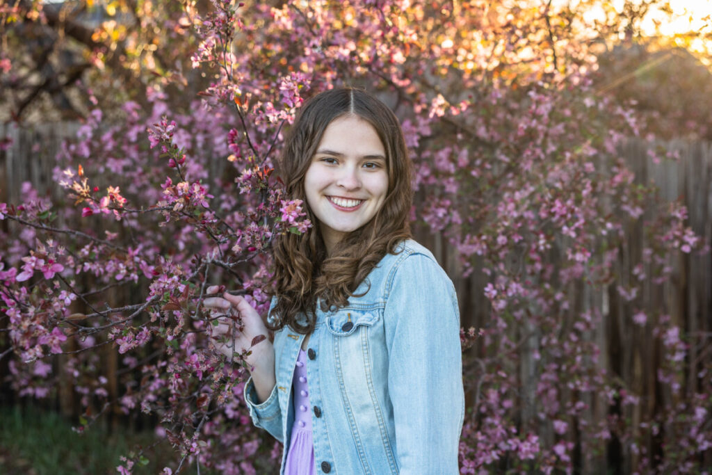 Littleton teen photographer in the spring blossoms