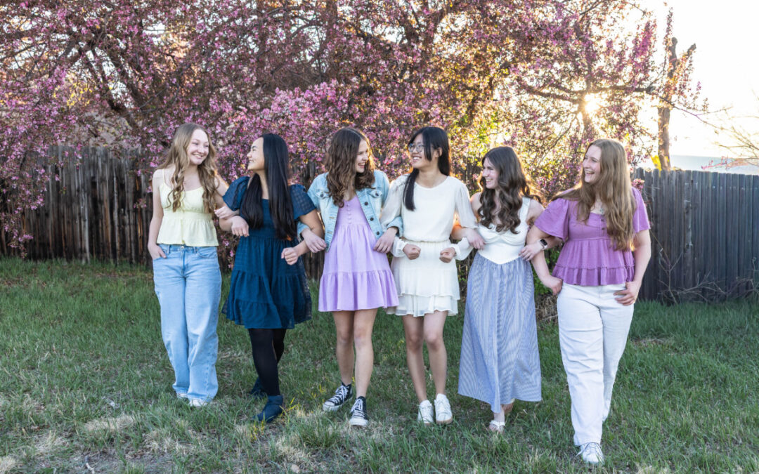 My daughter with her friends in the pink blossoming trees