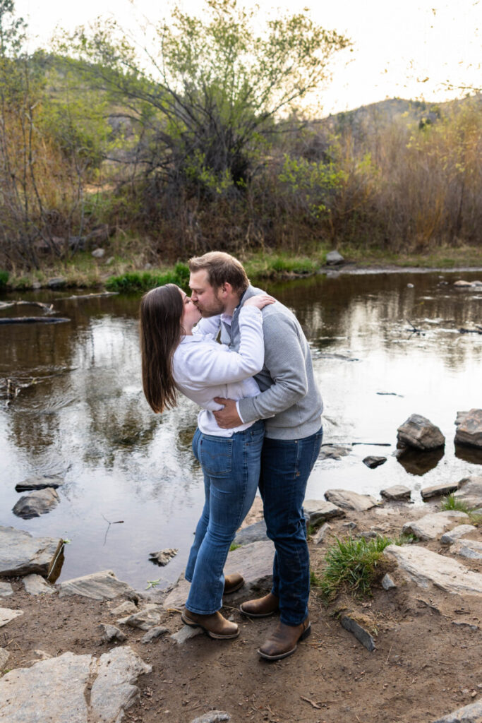 Engaged couple near the river in Morrison Colorado