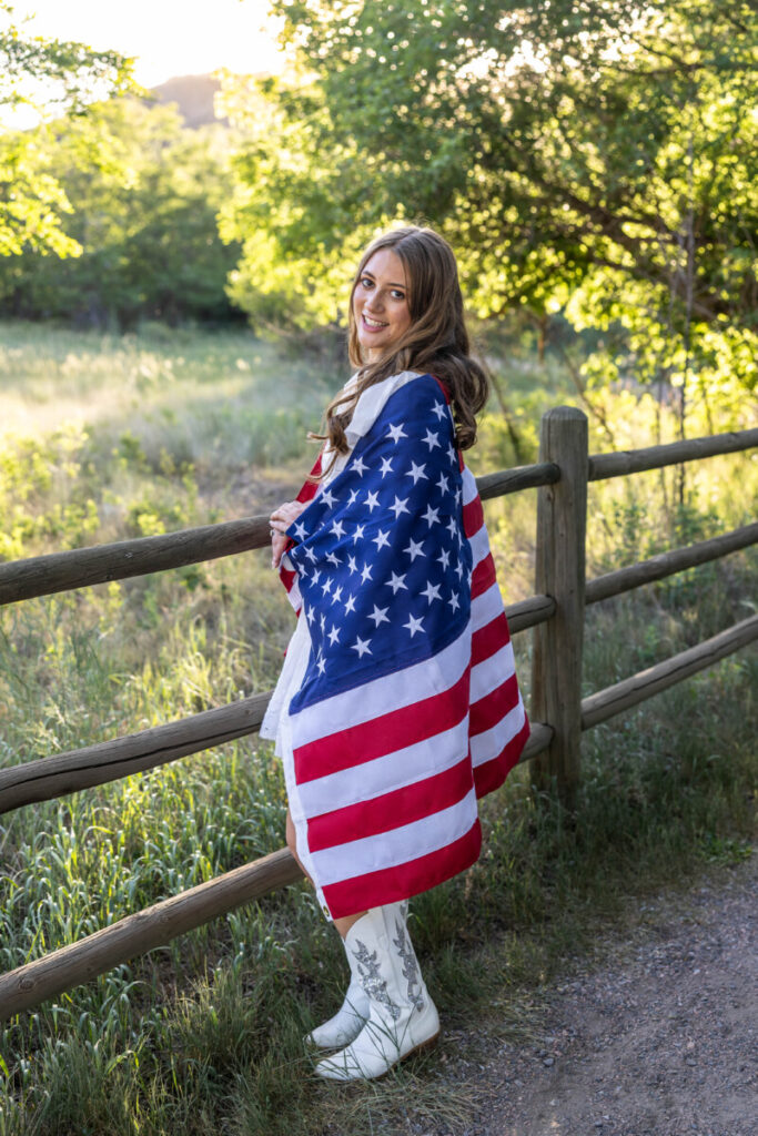 Teen senior girl photo session in Colorado with American flag
