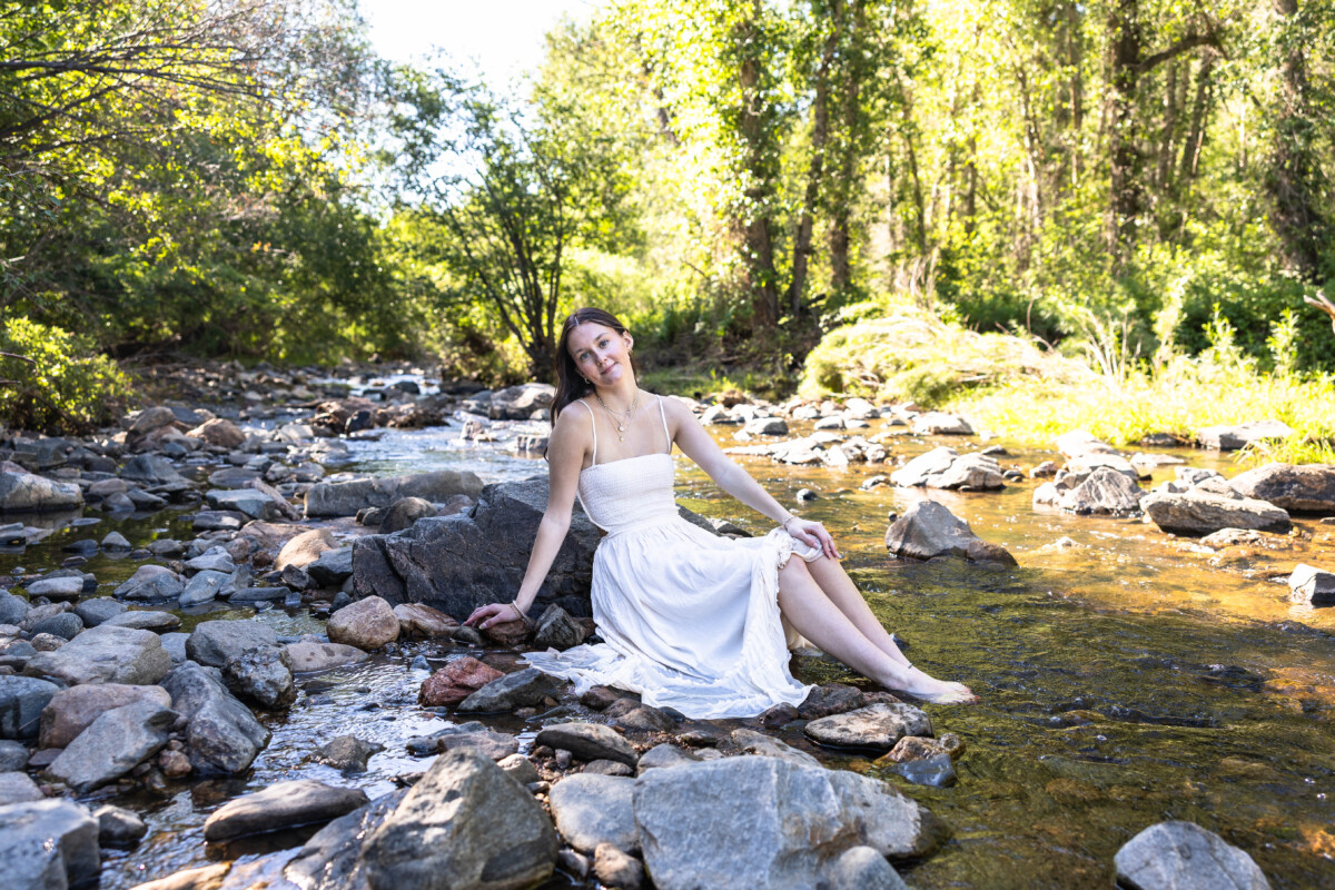 Colorado senior photographer in a river with a teen