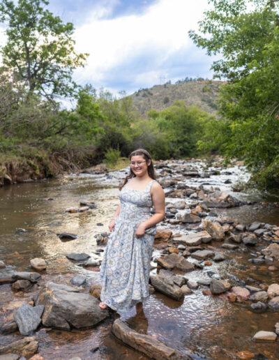 Colorado high school senior photography session in the river with the foothills