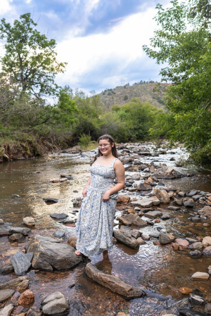 Colorado high school senior photography session in the river with the foothills