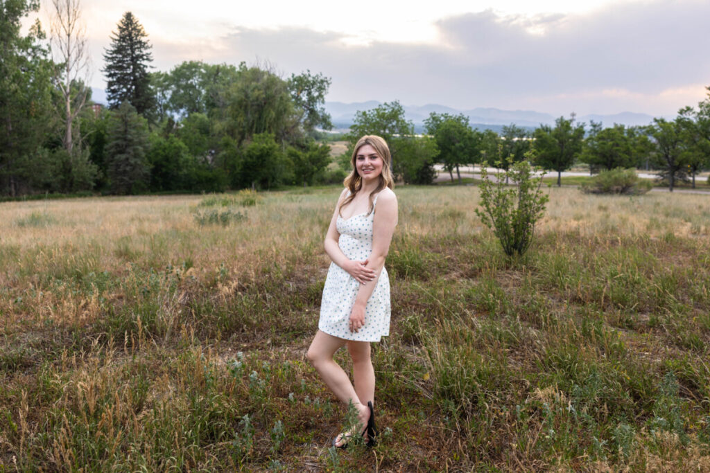 Colorado senior photographer with sunset over the foothills