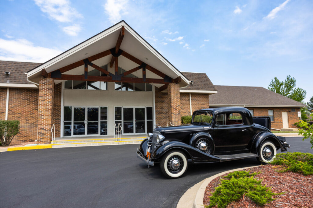 Littleton wedding photographer in Colorado at Baptist church with vintage car