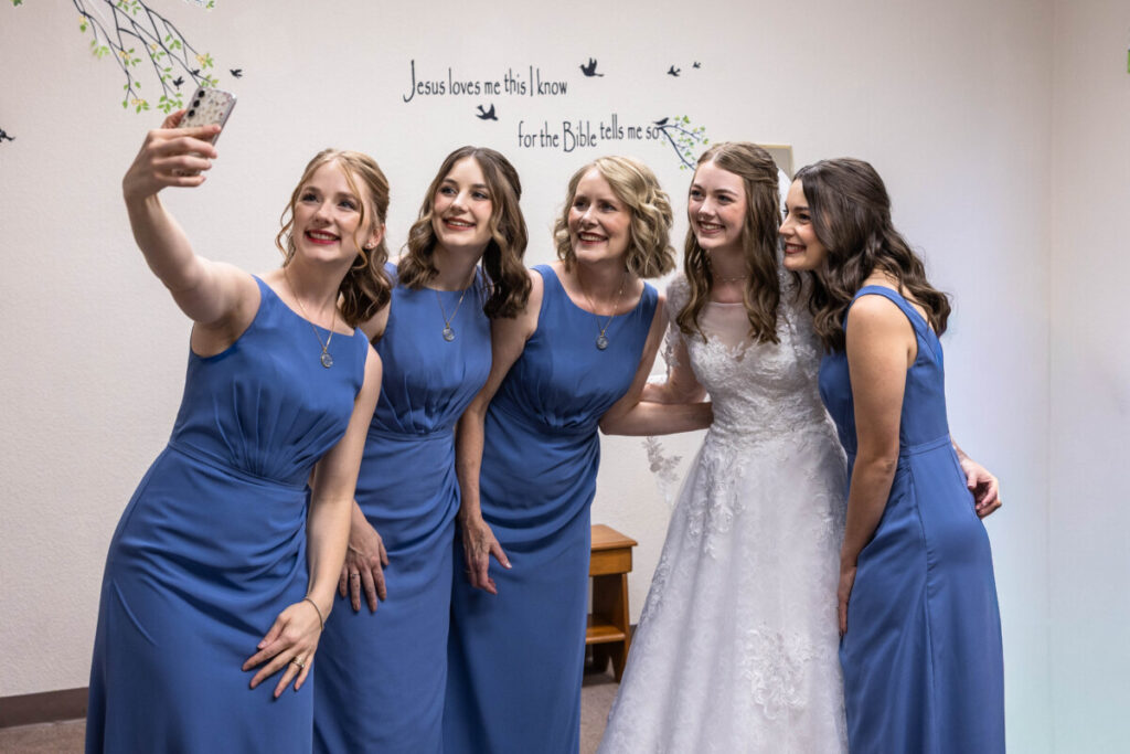Bride and bridesmaids selfie before wedding