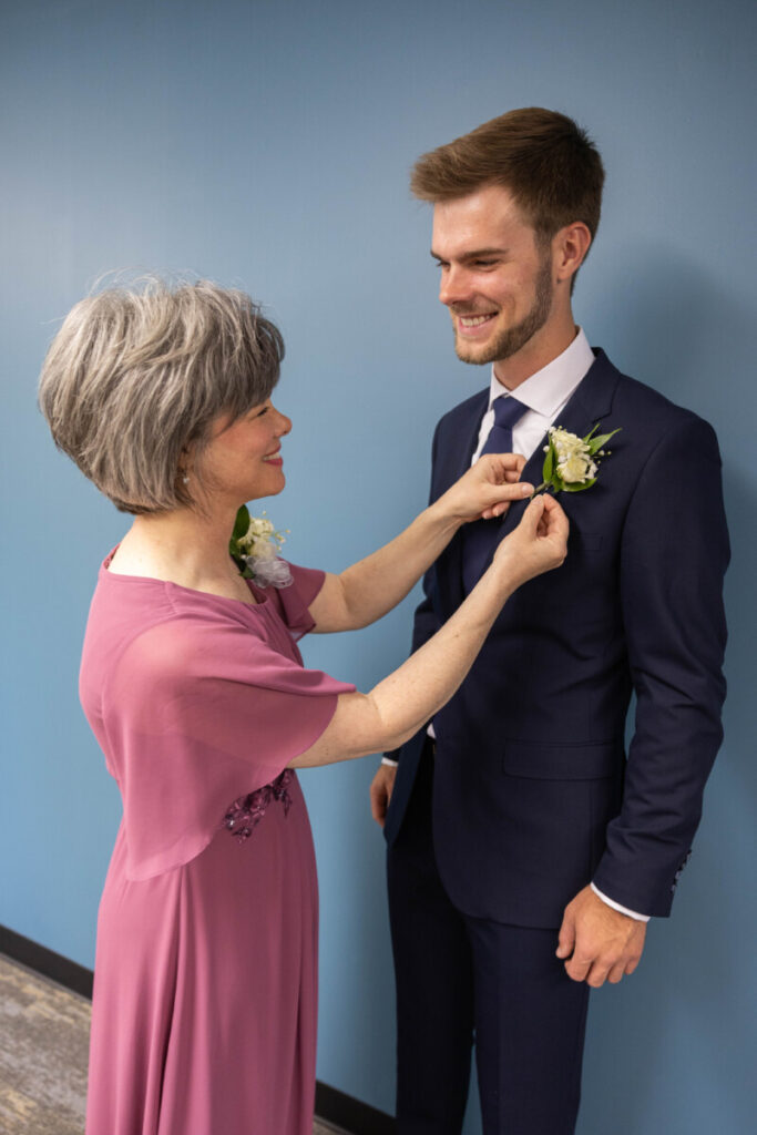 Mother of the groom with boutonniere at wedding
