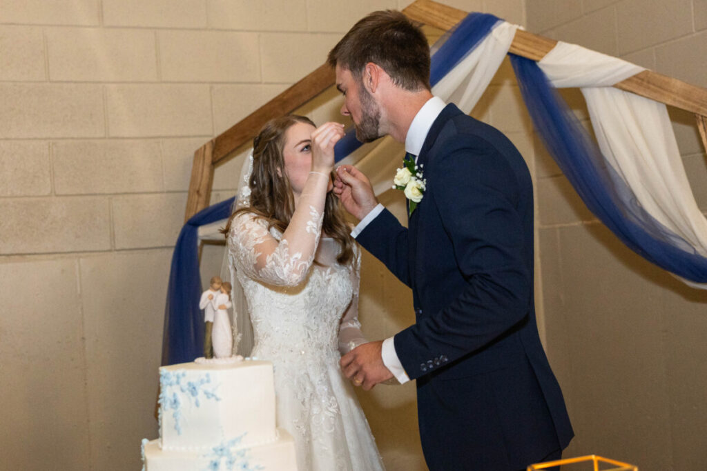 Bride and groom in Colorado cutting cake