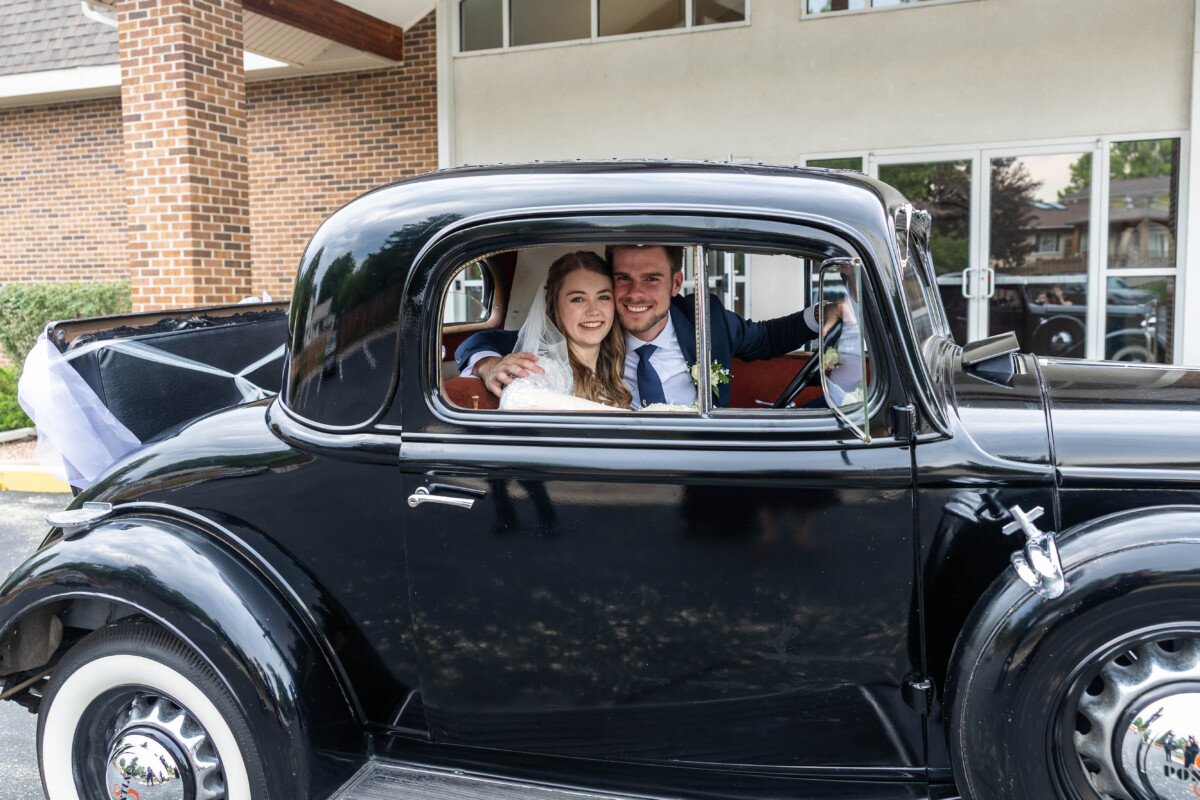 Littleton Colorado wedding with bride and groom in vintage car