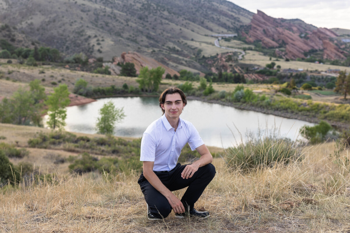 High school senior photography session with water and red rocks