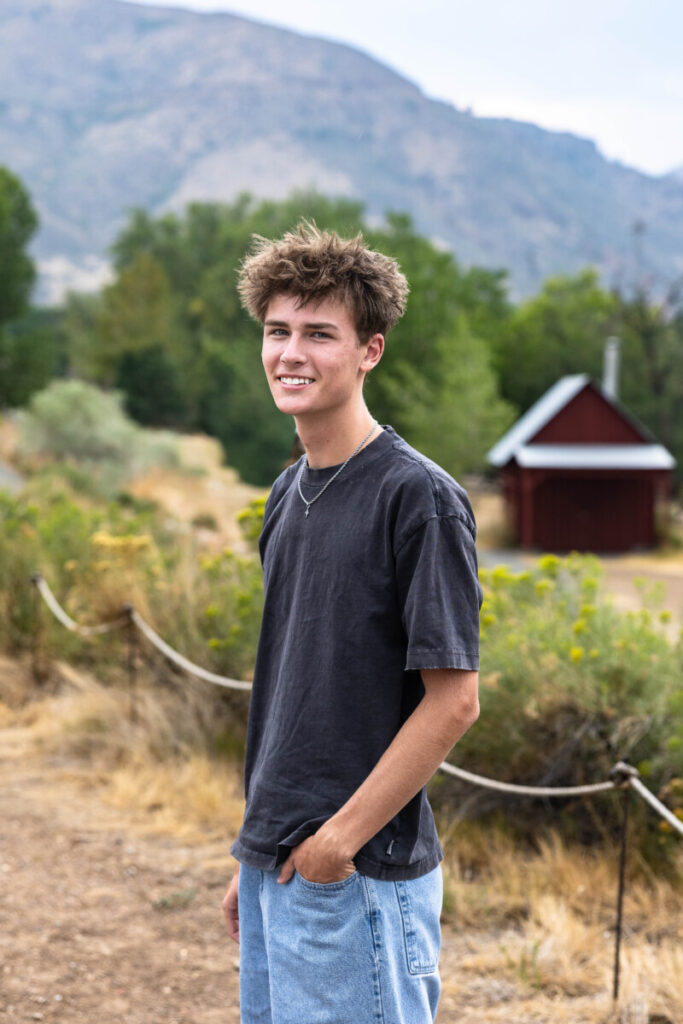Colorado foothill senior photography session at sunset with teen boy