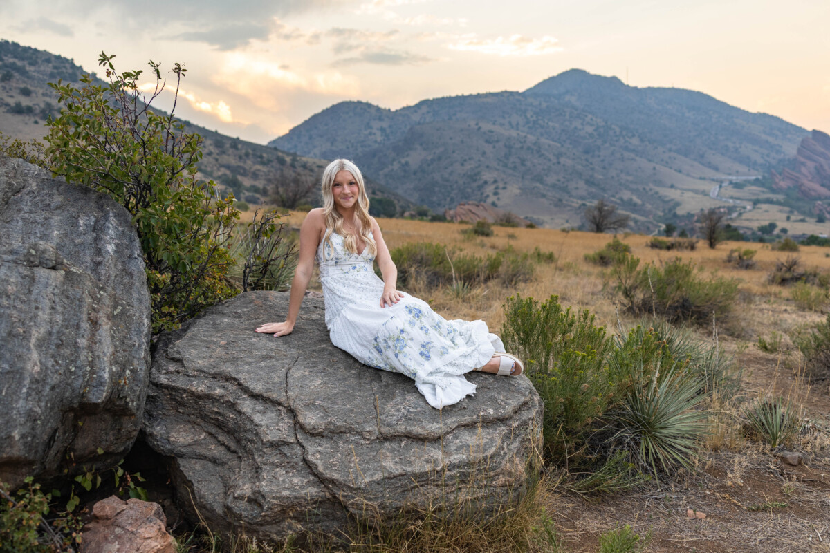 High school senior photography session in Colorado at sunset with red rocks