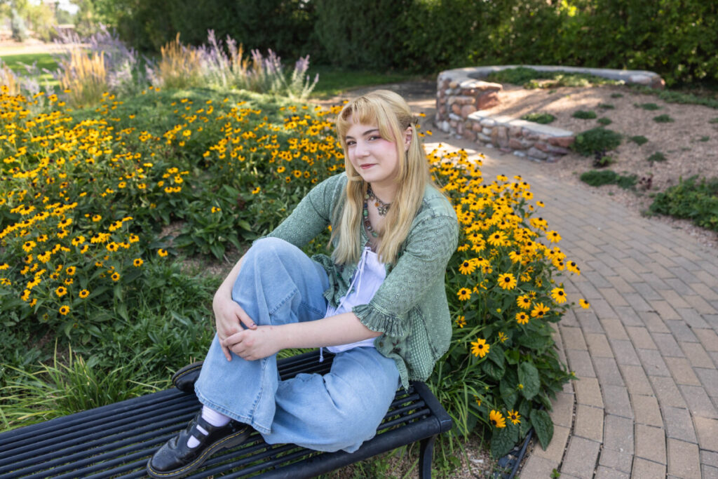 Colorado high school senior photographer with teen girl and flowers