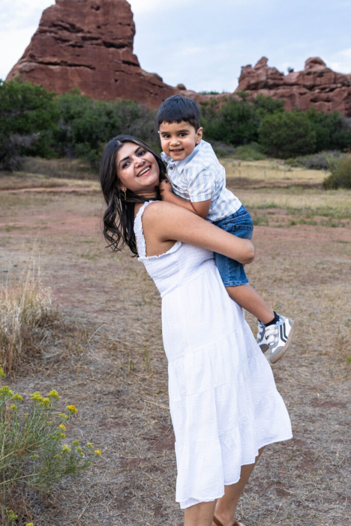 Colorado family photographer with red rocks at sunset