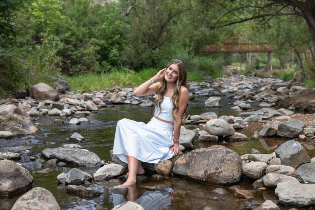 Colorado senior photographer in a river