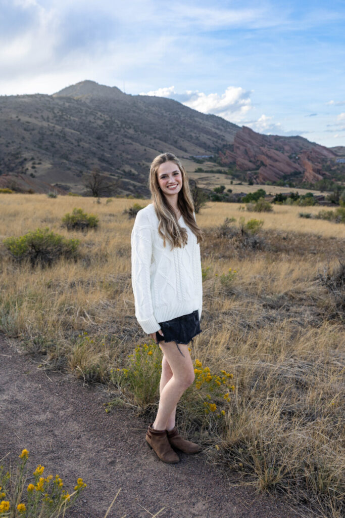 Littleton family photographer with teen and red rocks