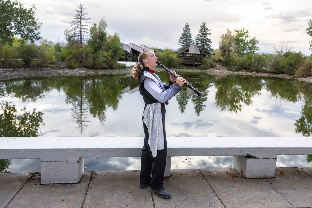 Colorado high school senior photographer with clarinet at sunset