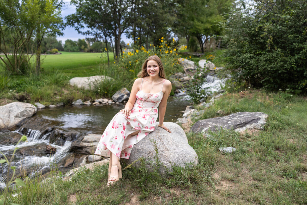 Colorado high school senior photography session with wildflowers and water