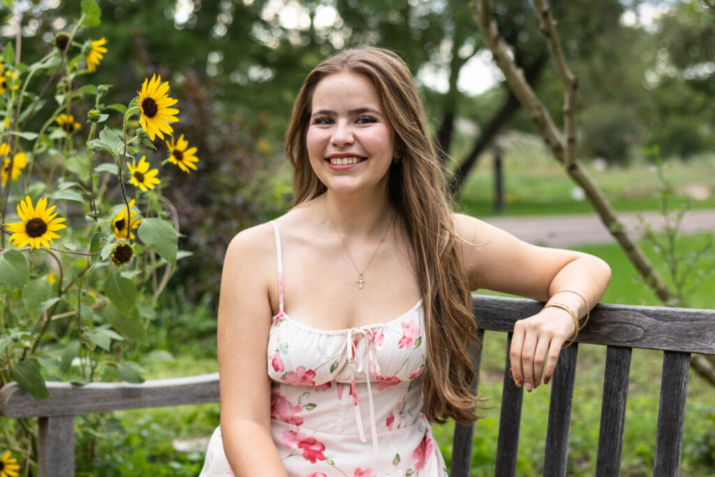 High school senior photography session with sunflowers in Colorado